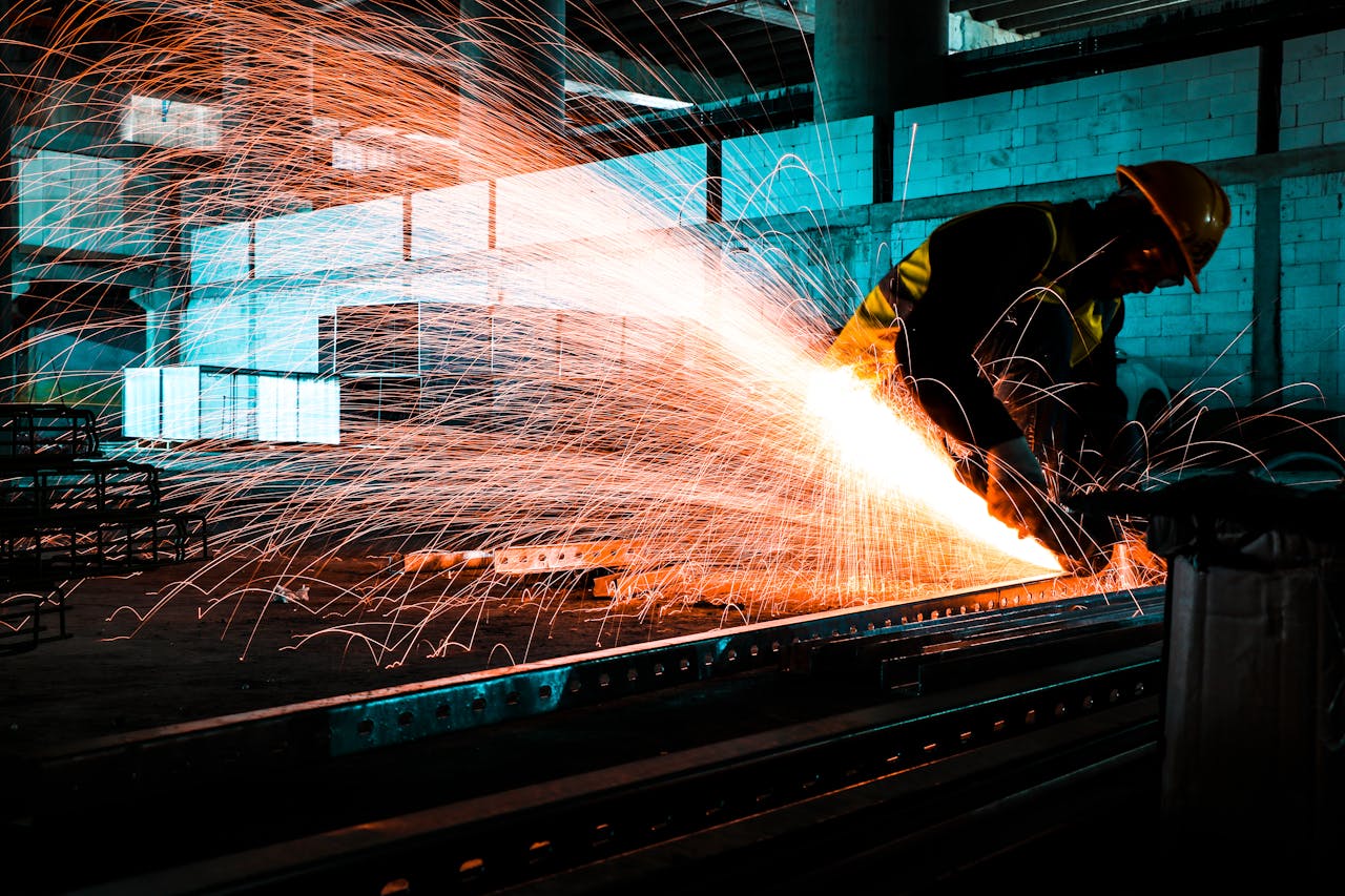 A man welding with fire sparks